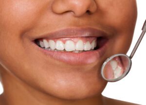 Holistic dentists focus on factors that can influence gum health and increase the risk of developing gum disease.